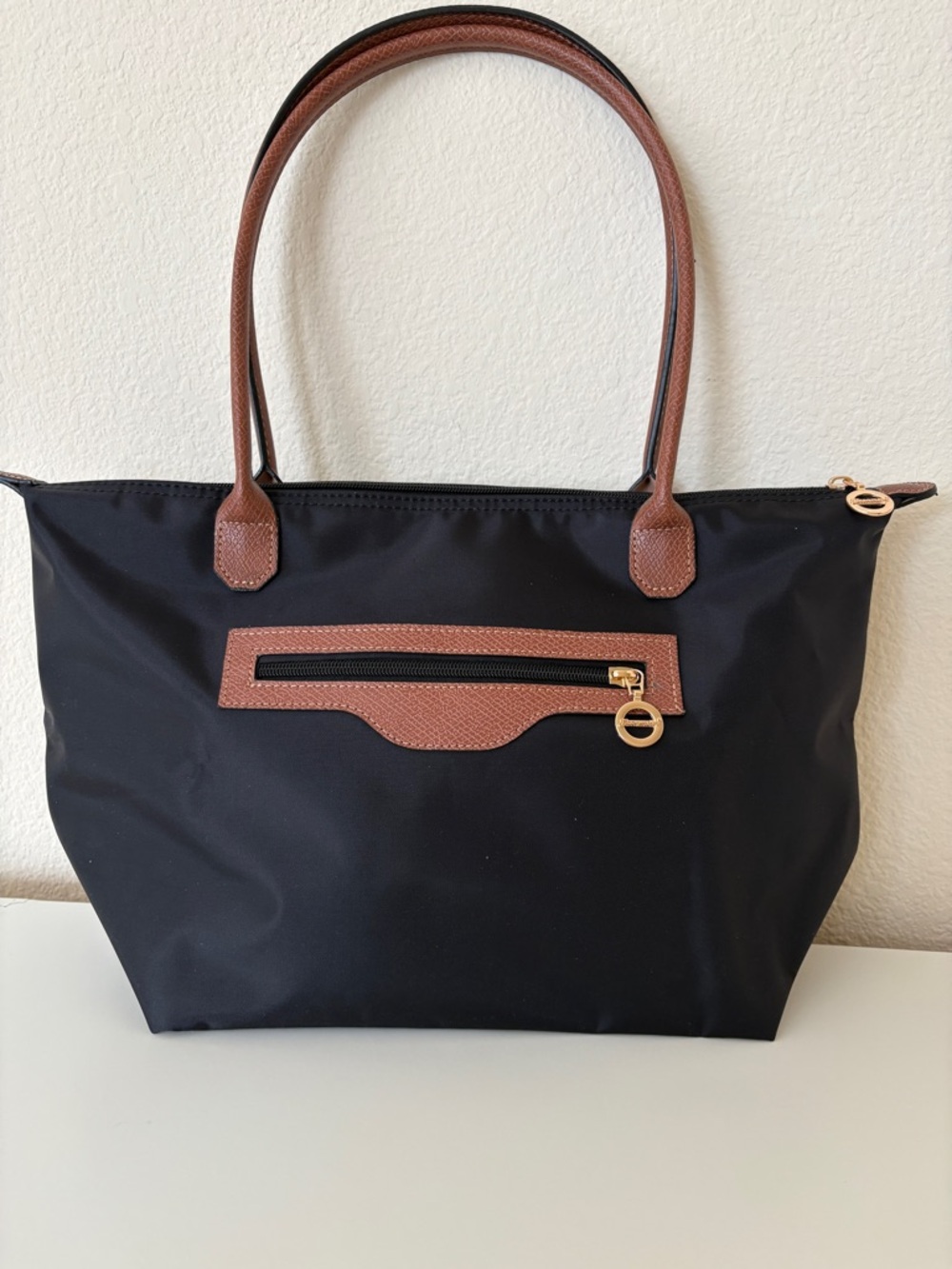Amazon Black Tote with Brown Trim and Gold Accents
